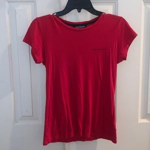 A red tee shirt by Calvin Klein Jeans